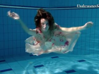 Russian girl Edwiga swims nude in the pool in Russia