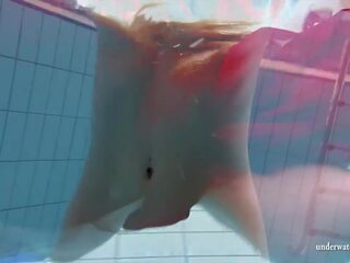 Desiring babes swim nude underwater