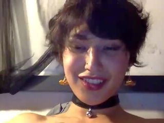 Charming lover in belled choker orgasms intensely