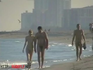 Peeping at a magnificent nudist couple on the beach